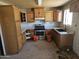 Kitchen featuring wood cabinets, stainless steel appliances, and potential for a modern upgrade at 4110 E Wagoner Rd, Phoenix, AZ 85032