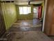 A look at an unfinished living room with bright green walls and a ceiling fan at 4110 E Wagoner Rd, Phoenix, AZ 85032