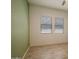 Spacious bedroom with wood-look tile floors, light walls, and a window offering natural light at 41215 W Almira Dr, Maricopa, AZ 85138