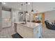 Bright kitchen featuring a kitchen island, pendant lighting, stainless steel appliances, and eat-in dining area at 41215 W Almira Dr, Maricopa, AZ 85138