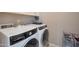 Bright laundry room with white washer and dryer at 41215 W Almira Dr, Maricopa, AZ 85138
