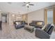 Open floorplan boasting a dining area and living area with a leather sofa set at 41215 W Almira Dr, Maricopa, AZ 85138