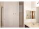 Bathroom featuring vanity with mirror, sink, countertop, and shower with a glass door at 4145 E Santa Fe Ln, Gilbert, AZ 85297