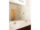 Bathroom vanity featuring double sinks, chrome fixtures, and mirror at 4145 E Santa Fe Ln, Gilbert, AZ 85297