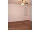 Bedroom with neutral walls, ceiling fan and patterned carpet at 4145 E Santa Fe Ln, Gilbert, AZ 85297