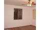 Bedroom featuring neutral paint, carpet flooring, ceiling fan, and a large window at 4145 E Santa Fe Ln, Gilbert, AZ 85297