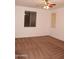 Bedroom featuring neutral paint, carpet flooring, ceiling fan, and two windows at 4145 E Santa Fe Ln, Gilbert, AZ 85297