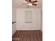 Bedroom with neutral walls, ceiling fan and patterned carpet at 4145 E Santa Fe Ln, Gilbert, AZ 85297