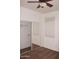 Bedroom with mirrored closet, neutral walls and ceiling fan at 4145 E Santa Fe Ln, Gilbert, AZ 85297