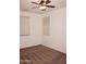Bedroom with neutral walls, ceiling fan and patterned carpet at 4145 E Santa Fe Ln, Gilbert, AZ 85297