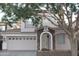 Charming two-story home featuring a stone-accented entrance and a well-maintained front yard at 4145 E Santa Fe Ln, Gilbert, AZ 85297