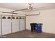 Spacious garage with automated door and trash receptacles at 4145 E Santa Fe Ln, Gilbert, AZ 85297