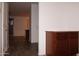 Hallway featuring hardwood floors and a built in cabinet with drawers and countertop at 4145 E Santa Fe Ln, Gilbert, AZ 85297
