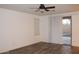 Bright living room featuring wood-look flooring and a sliding door that provides backyard access at 4145 E Santa Fe Ln, Gilbert, AZ 85297