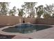 Private backyard pool with tiled accents, a water feature, and ample space for outdoor relaxation at 4145 E Santa Fe Ln, Gilbert, AZ 85297