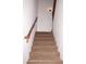 Carpeted staircase with wooden handrail leading to the upper level of the home at 4145 E Santa Fe Ln, Gilbert, AZ 85297