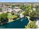 A sprawling property featuring a home with pool access and waterfront views on a scenic lake at 422 E Kaibab Pl, Chandler, AZ 85249