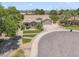 This aerial view showcases a meticulously landscaped home on a cul-de-sac with well-maintained gardens and a two-car garage at 422 E Kaibab Pl, Chandler, AZ 85249