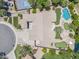This overhead view reveals a home with a pool, putting greens, a patio area, beautiful landscaping and circular driveway at 422 E Kaibab Pl, Chandler, AZ 85249