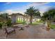 Stylish back patio featuring comfortable outdoor seating, mature shade trees, and an elegantly landscaped garden at 422 E Kaibab Pl, Chandler, AZ 85249