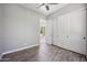 Clean bedroom with wood-look floors and double door closet at 422 E Kaibab Pl, Chandler, AZ 85249