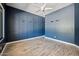 Bedroom with custom paneled wall and decorative shelving at 422 E Kaibab Pl, Chandler, AZ 85249