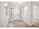 Bright foyer featuring a decorative light fixture, neutral walls, and a stylish rug at 422 E Kaibab Pl, Chandler, AZ 85249