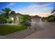 Charming home with stone accents, desert landscaping, and a circular driveway at 422 E Kaibab Pl, Chandler, AZ 85249