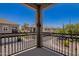 Balcony with wrought iron railing and view of the street and surrounding neighborhood at 4705 E Red Oak Ln # 101, Gilbert, AZ 85297