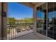 Balcony has wrought iron railing and view of the parking area and community at 4705 E Red Oak Ln # 101, Gilbert, AZ 85297