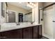 Bathroom featuring double sinks and a glass-enclosed shower at 4705 E Red Oak Ln # 101, Gilbert, AZ 85297