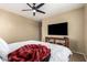 Bedroom with a ceiling fan and wooden console at 4705 E Red Oak Ln # 101, Gilbert, AZ 85297