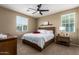 Bright bedroom with a ceiling fan, natural light, and simple decor at 4705 E Red Oak Ln # 101, Gilbert, AZ 85297