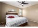 Comfortable bedroom featuring a ceiling fan and natural lighting at 4705 E Red Oak Ln # 101, Gilbert, AZ 85297