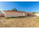Property featuring large backyard with exterior entrance to bonus room and carport at 5649 W Holly St, Phoenix, AZ 85035