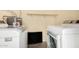 Convenient laundry room features new, modern washer and dryer appliances at 5649 W Holly St, Phoenix, AZ 85035