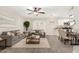 Open concept living room with a dining area and a bright, modern kitchen at 5649 W Holly St, Phoenix, AZ 85035