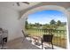 This balcony has wrought iron railings and great views of the golf course and blue sky at 6138 N 28Th St, Phoenix, AZ 85016