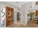 View of front foyer featuring hardwood floors, stained glass window, and wooden door at 6138 N 28Th St, Phoenix, AZ 85016