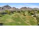 Beautiful aerial view showcasing a well-manicured golf course with mountain views in the background at 6138 N 28Th St, Phoenix, AZ 85016