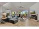 This elegant living room has a fireplace, access to a balcony, and a mirrored accent wall at 6138 N 28Th St, Phoenix, AZ 85016