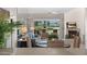 Spacious living room with fireplace, view to balcony, and golf course at 6138 N 28Th St, Phoenix, AZ 85016