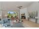 This open living room has a fireplace, access to the balcony, and lots of natural light at 6138 N 28Th St, Phoenix, AZ 85016