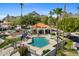Aerial view of pool area with clubhouse, lounge chairs and palm trees at 6138 N 28Th St, Phoenix, AZ 85016