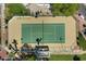Overhead shot of green and tan tennis court, enclosed by a fence at 6138 N 28Th St, Phoenix, AZ 85016