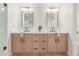 Bathroom featuring double sink vanity, quartz countertop, wood cabinets, and modern fixtures at 6439 E Redmont Dr, Mesa, AZ 85215
