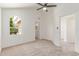 Bedroom with bright windows, high ceilings, and carpet at 6439 E Redmont Dr, Mesa, AZ 85215