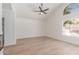 Empty bedroom with high ceilings, a ceiling fan, and a large window at 6439 E Redmont Dr, Mesa, AZ 85215