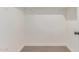 Carpeted walk-in closet featuring white walls and baseboards at 6439 E Redmont Dr, Mesa, AZ 85215