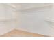 Spacious walk-in closet with wood floors and white walls at 6439 E Redmont Dr, Mesa, AZ 85215